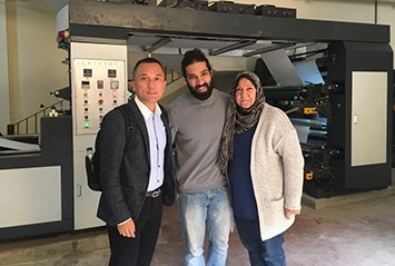 Another joint photo with Egypt client in front of our flexo printing machine.